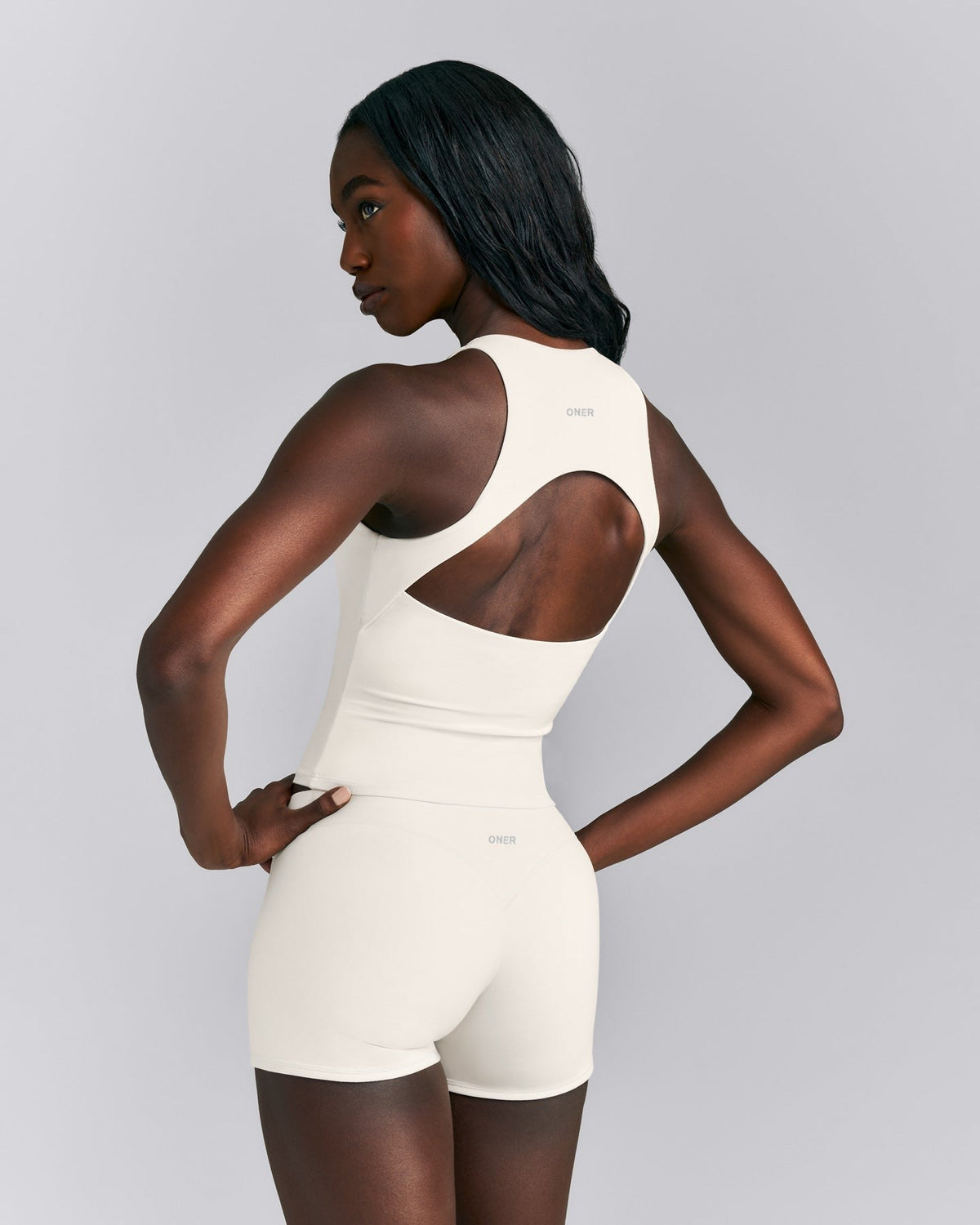 SoftMotionTM High Neck Mid Tank with Built in Bra Shelf | Marshmallow White
