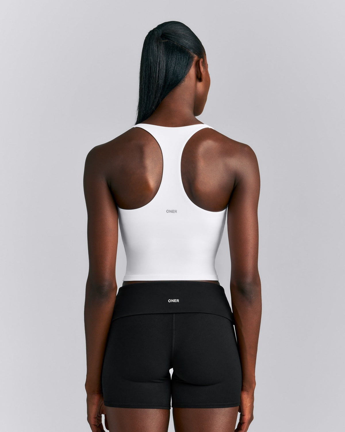 SoftMotionTM Racer Back Mid Tank Top with Built in Bra Shelf | White